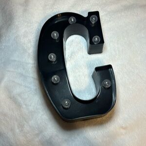 Black light up letter C wall decor